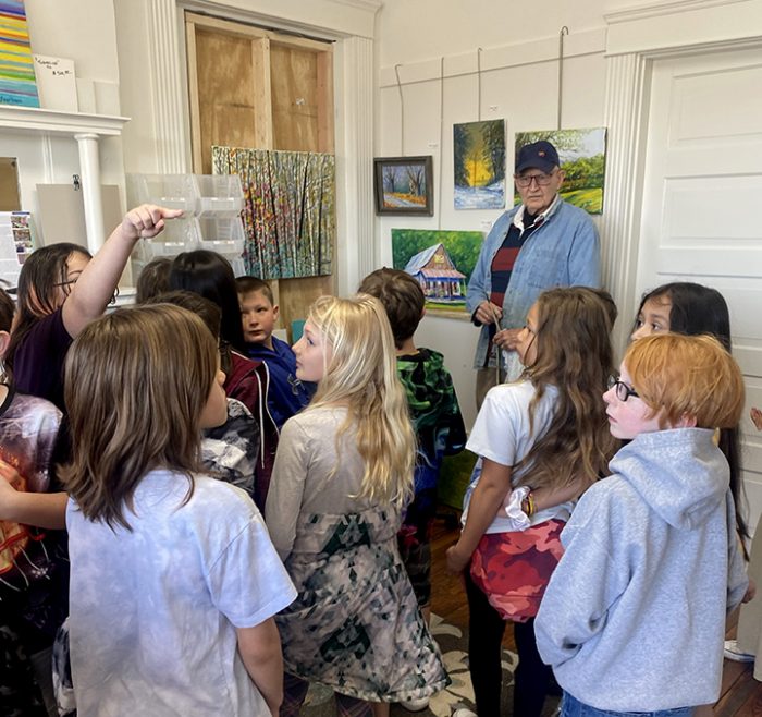 Kids visiting an artist's studio at Art Center of the Bluegrass in Danville, Kentucky