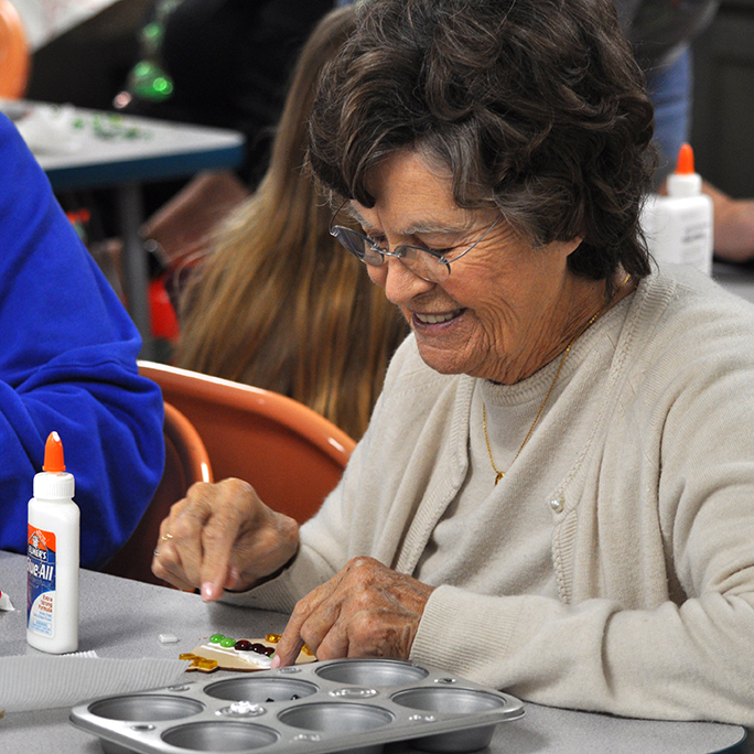 Woman making a mosaic at the Art Center